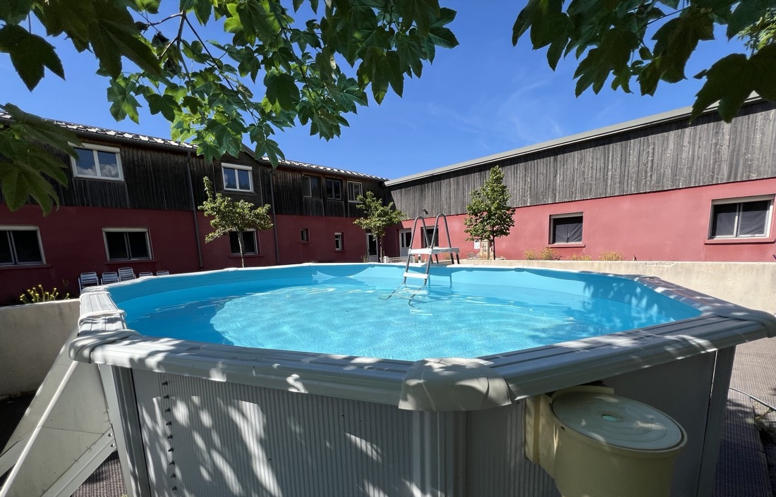 The lodge's swimming pool seen from the courtyard